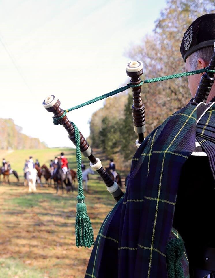 Bagpiper leading the meet
