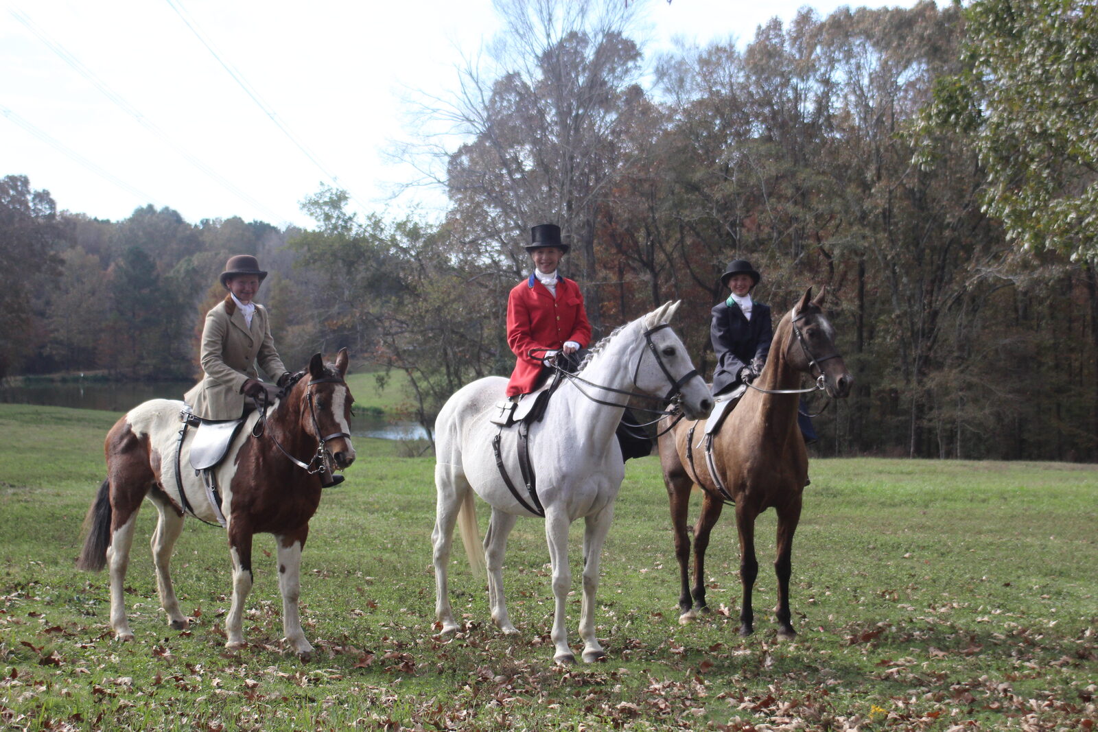 Riders in scarlet crossing open country
